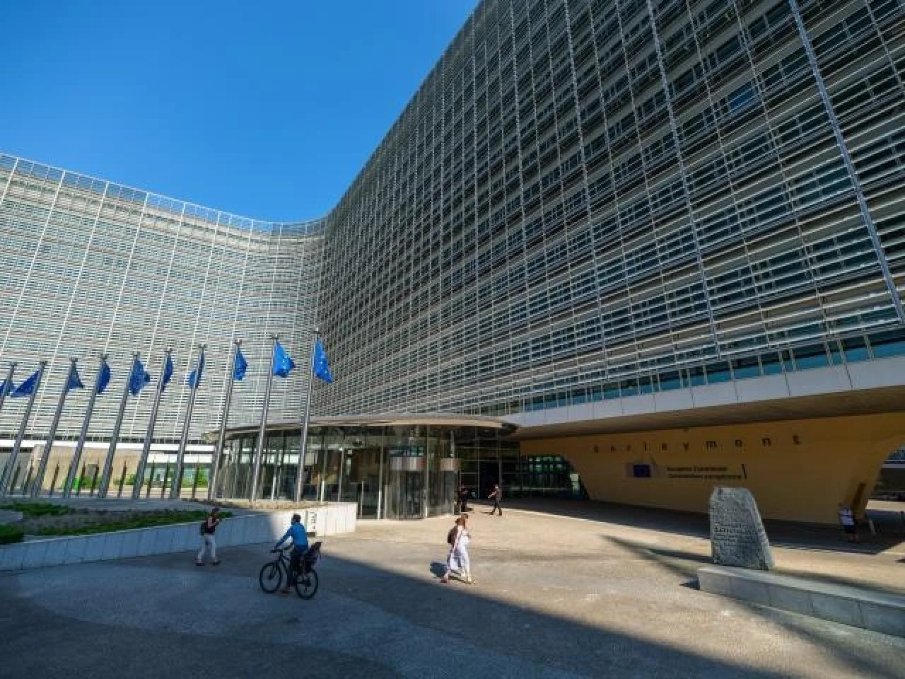 Entrance and European flags at the European Commission's Berlaymont building in Brussels